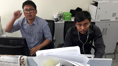 Reuters journalists Wa Lone, left, and Kyaw Soe Oo, who are based in Myanmar, pose for a picture at the Reuters office in Yangon, Myanmar, Dec. 11, 2017.